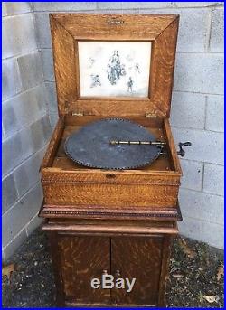 15 1/2 Regina Oak Double Comb Disc Music Box With Oak Cabinet