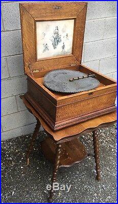 15 1/2 Regina Oak Double Comb Disc Music Box With Oak Stand