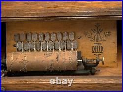 A Victorian Oak Cased Crank Roller Organ