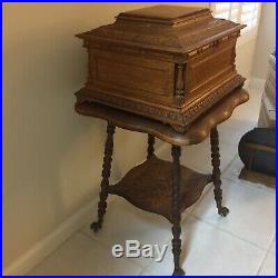 Antique Oak Regina Music Box, Claw-Foot Table, and 42 Discs