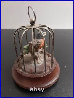 Antique singing bird in a cage, a mechanical music box Working Tested