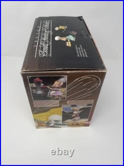 C. 1992 Enesco Home On The Range Deluxe Illuminated Action Musical