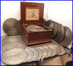 Regina 15.5 Mahogony Music Box with 27 Discs Inlaid & Carved Cabinet Works Great