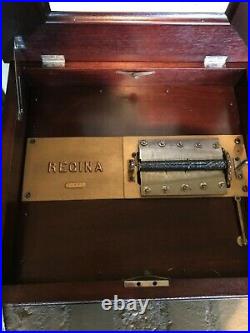 Regina Double Comb Oak Cabinet Music Box With 15 15 1/2 Inch Discs