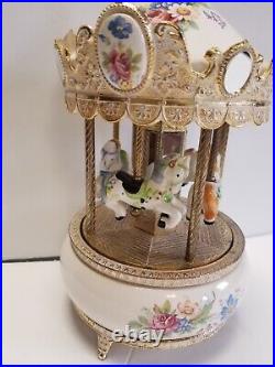 The San Francisco Music Box Company 4 Horse Rotating Carousel Porcelain