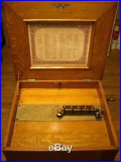 Very early 1892 REGINA music box, in golden oak case, with 30 tune discs