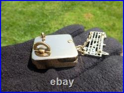Vintage Swiss Reuge Miniature Music Box Gold Tone Case Musical Brooch