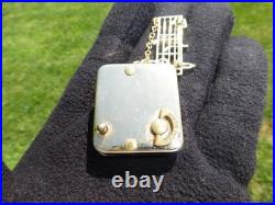 Vintage Swiss Reuge Miniature Music Box Gold Tone Case Musical Brooch