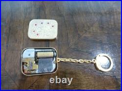 Vintage Swiss Reuge Miniature music box pendant, Key Chain, Ruby Stones Front