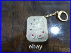 Vintage Swiss Reuge Miniature music box pendant, Key Chain, Ruby Stones Front