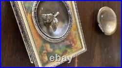 Vintage victorian style metal music box with wind up humming bird