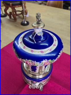 Vtg. Reuge Capodimonte cherub carousel lipstick/cigarette music Box
