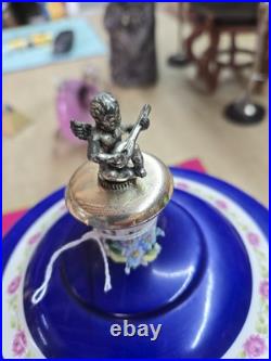 Vtg. Reuge Capodimonte cherub carousel lipstick/cigarette music Box